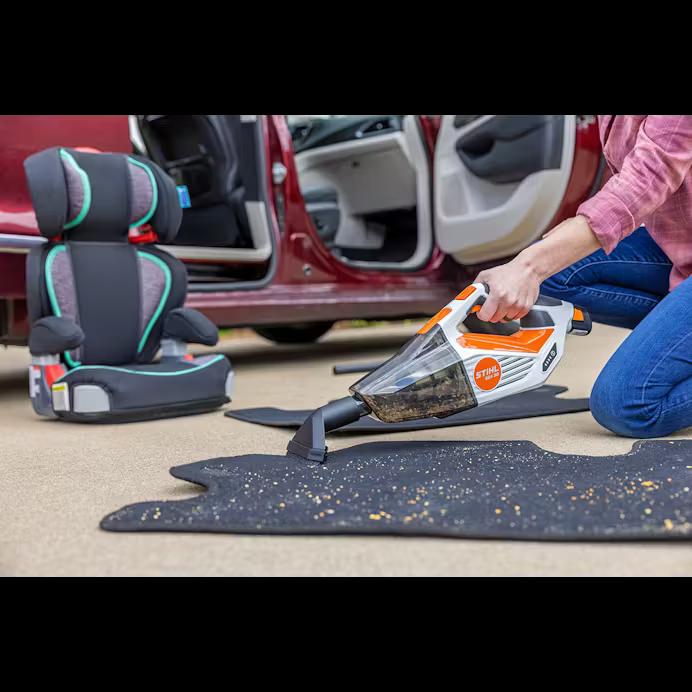 Person Cleaning Car With Vacuum